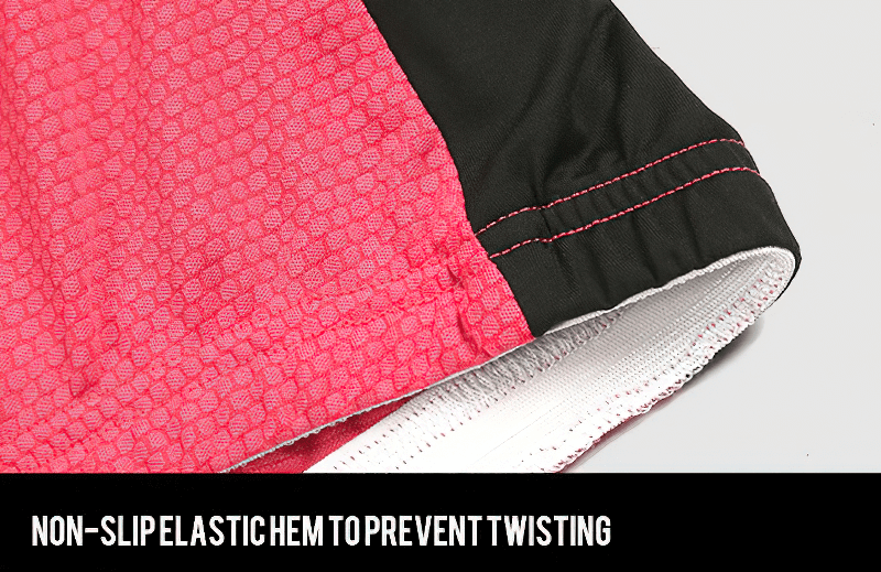 Close-up of pink cycling jersey with non-slip elastic hem to prevent twisting and ensure a secure fit.